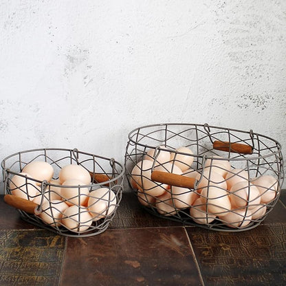 CVHOMEDECO. Oval Wire Egg Baskets Rustic Fruit Baskets with Wooden Handles Primitives Vintage Gathering Basket. Rusty, Set of 2